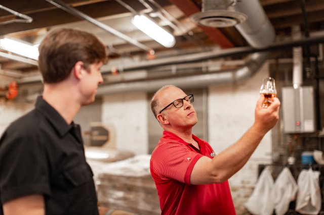Scott gives a tour in the distillery.