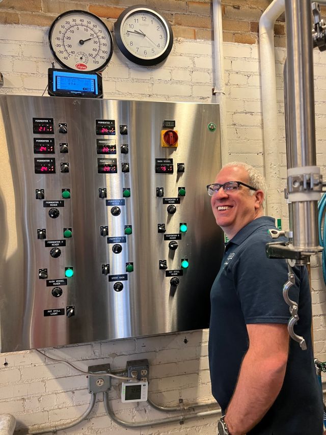 Image of individual making whisky.