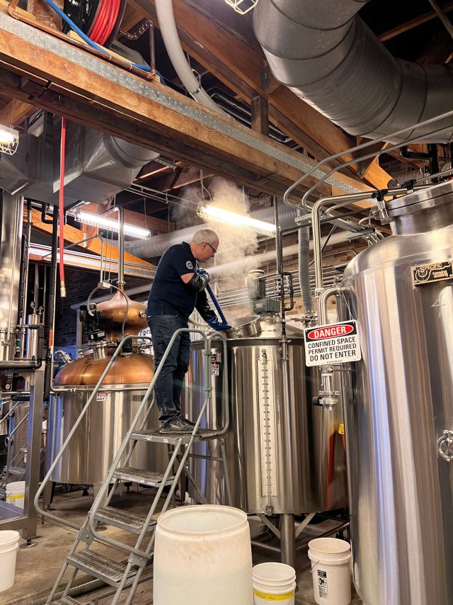 Image of individual making whisky.