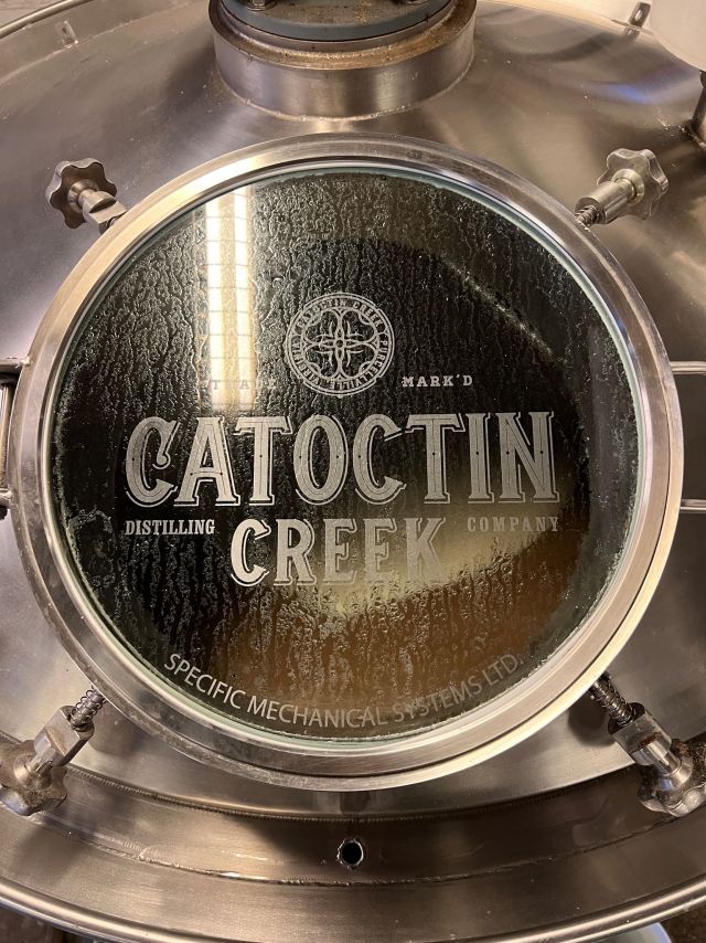 Image of individual making whisky.