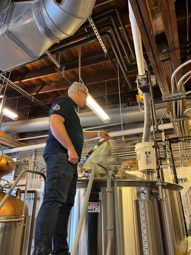 Image of individual making whisky.