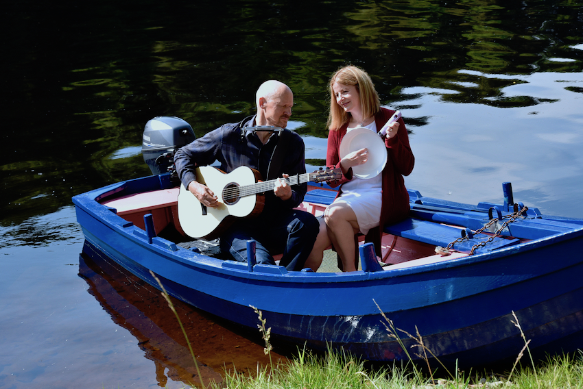 Jim and Susie in a boat with instruments